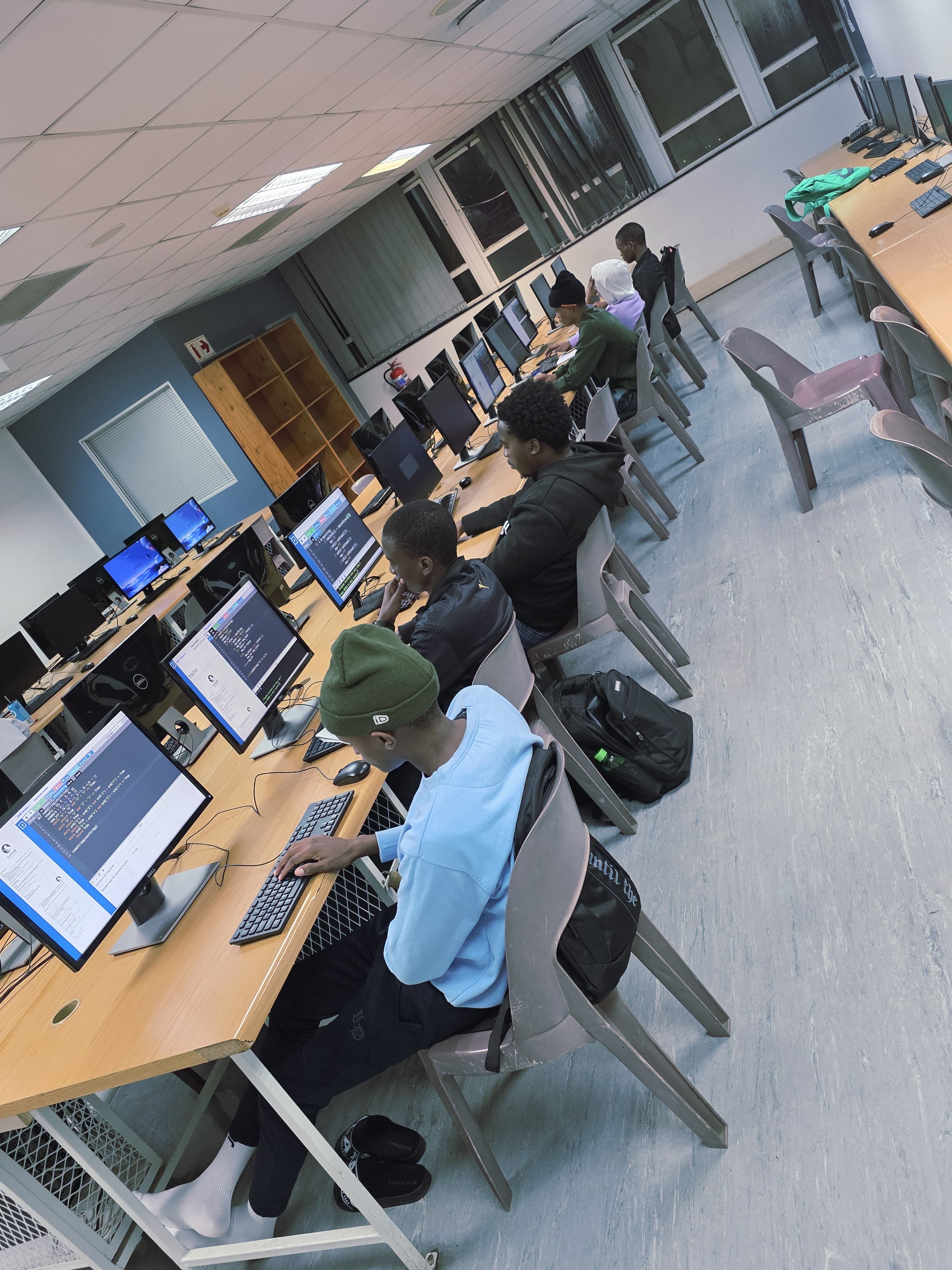 Students collaborating and learning software development together